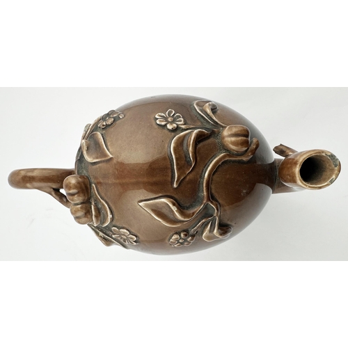 669 - CHINESE WINE POT. 6.5ins tall. Shiny brown Tenmoku style glaze with flowers & leaf design, side hand... 