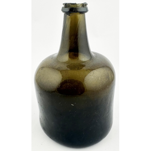 704 - ENGLISH MALLET WINE BOTTLE. 7.1ins tall. Black/ dark green glass. Short, stumpy, neck, deep base kic... 