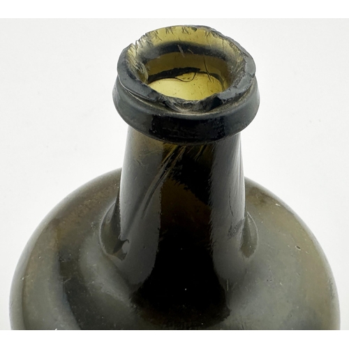 704 - ENGLISH MALLET WINE BOTTLE. 7.1ins tall. Black/ dark green glass. Short, stumpy, neck, deep base kic... 