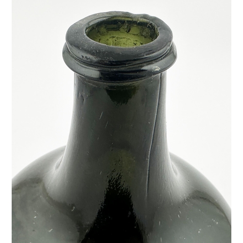 705 - ENGLISH MALLET WINE BOTTLE. 7ins tall. A noticeably dark black/ dark olive green glass to what is no... 