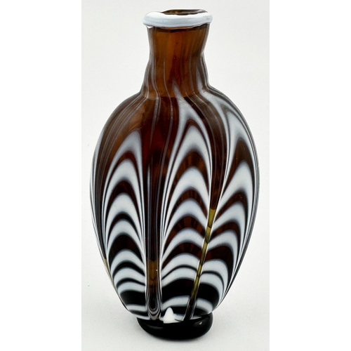 707 - NAILSEA FLASK. 5.25ins tall. Dark/ reddy brown glass, featuring classic white linear patterning thro... 