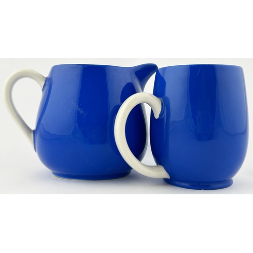 109 - GUINNESS JUG DUO. Tallest 4.25ins. Bright blue with white & yellow transfer with harp to one side. C... 