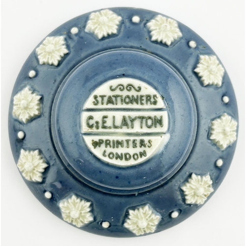 119 - G E LAYTON STATIONERS PRINTERS LONDON. 4ins diam. Unusual heavy pottery paperweight. Blue with white... 