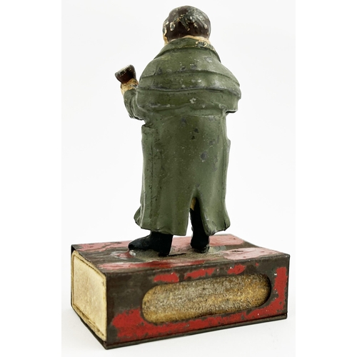 149 - BRYANT & MAY ADVERTISING FIGURE & MATCHBOX HOLDER. 3.8ins tall. Heavy metal period dressed gent with... 