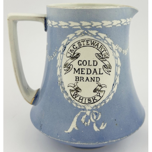 188 - J & G STEWARTS GOLD MEDAL BRAND WHISKY WATER JUG. 5.25ins tall. Delightful light blue body with whit... 