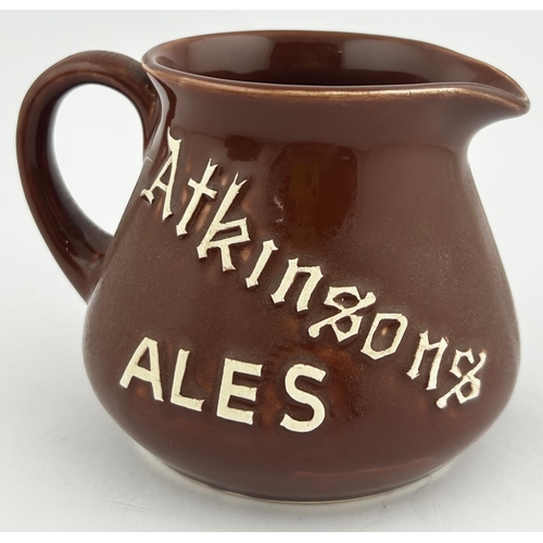 194 - ATKINSONS ALES PUB JUG. 4.1ins tall. T G A unique jug design featuring raised (sprig like) letters o... 