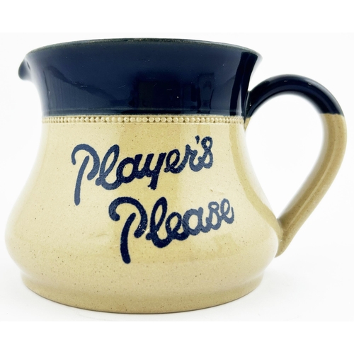 245 - PLAYERS PLEASE WATER JUG. 4ins tall. An unusual, heavy, stoneware squat jug. Off white body with dee... 