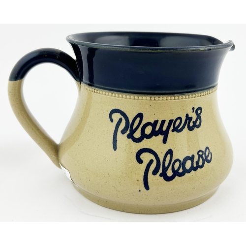 245 - PLAYERS PLEASE WATER JUG. 4ins tall. An unusual, heavy, stoneware squat jug. Off white body with dee... 