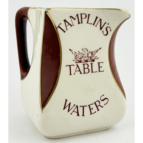 246 - TAMPLINS TALE WATERS WATER JUG. 4.7ins tall. Waisted square base shape, scalloped corners infilled w... 