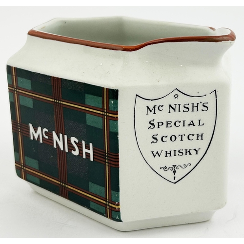 247 - McNISH WHISKY WATER JUG. 3.2ins tall. Hexagonal shape featuring colourful tartan design to 2 sides w... 