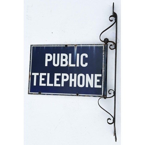 26 - PUBLIC TELEPHONE ENAMEL SIGN WITH STEEL WALL MOUNTING BRACKET. 30 x 20.2ins. Sturdy metal wall hangi... 