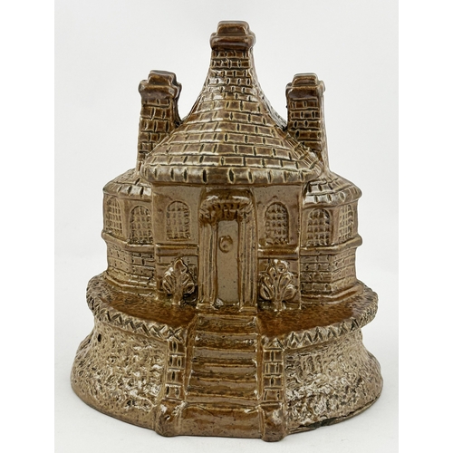 305 - HOUSE SHAPED MONEY BOX. 4.1ins tall. Chocolate brown shiny salt glaze. A very highly detailed two st... 