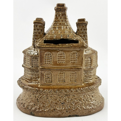 305 - HOUSE SHAPED MONEY BOX. 4.1ins tall. Chocolate brown shiny salt glaze. A very highly detailed two st... 