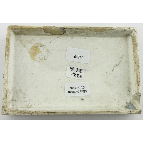 327 - LONDON CHERRY TOOTH PASTE POT LID. (APL p332, 37a) 3.6 x 2.5 ins diam. Rectangular, this the variati... 