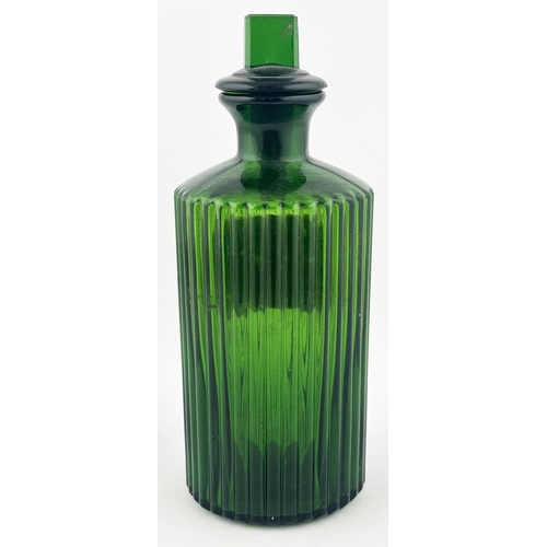 358 - RIBBED LABEL UNDER GLASS SHOP ROUND BOTTLE. 8ins tall. Bright green glass, inset affixed label, gold... 