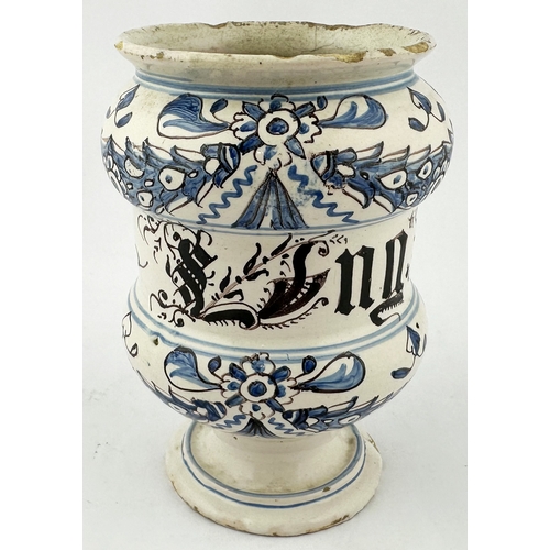 371 - TIN GLAZED DELFT STYLE DRUG JAR. 6.3ins tall. Squat dumbbell shape, hand decorated in blue & black, ... 