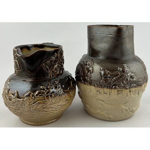 121 - SALT GLAZE DUO. Tallest 6.25ins. Sprigged hunting scene jugs, rear handles. Chips to one. (2)