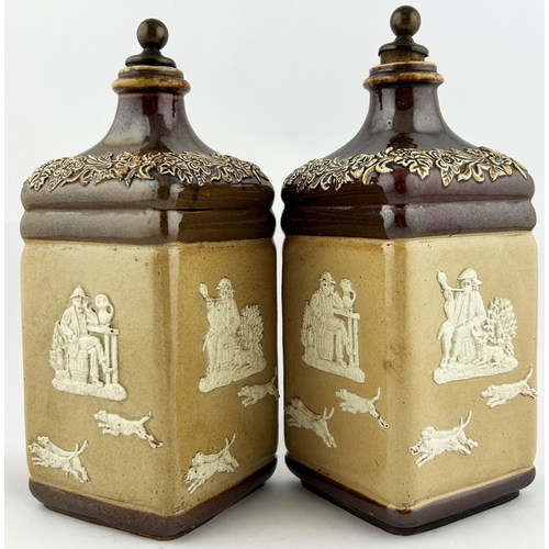 32 - SALT GLAZE DECANTERS DUO. Tallest 9.5ins. Heavily sprigged - hunting scene, windmills, rear handles ... 