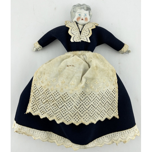 37 - PORCELAIN DOLL. 8.5ins tall. Small bodied doll porcelain head, hands & feet, big blue dress & white ... 