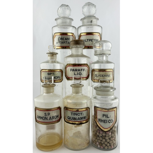 39 - CHEMIST ROUND GROUP. Tallest 10.5ins. Clear, label under glass, all with stoppers, some contents. Da... 