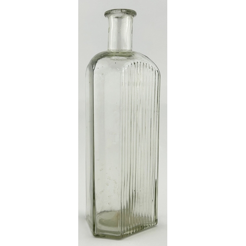 4 - POISON BOTTLE. 8.25ins tall. Clear glass, skull & cross bones motif & letters GIFT underneath, one s... 