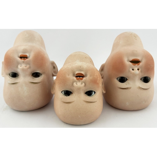 75 - DOLLS HEAD TRIO. Largest 4ins. Various markings to rear. (3)