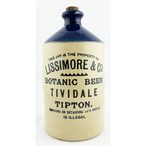 8 - TIVIDALE FLAGON. 11ins tall. Blue top, black transfer. Several lines of writing, rear handle. LISSIM... 