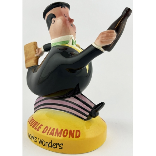 92 - DOUBLE DIAMOND ADVERTISING WATER JUG FIGURE. 7.75ins tall. City gent holding bag & bottle. Beswick b... 