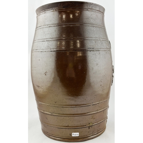 159 - SALT GLAZE BARREL. 15ins tall. Dark treacle glaze, heavily sprigged, coat of arms, knight on horse b... 