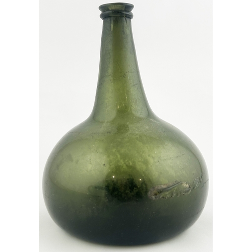 256 - ONION BOTTLE. 7.5ins tall. Dark green glass, base pontil, long neck. Blow hole.