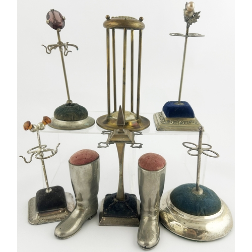 278 - HAT PIN GROUP. Tallest 6ins. Various shapes: Boots & different stands. Pewter? Boots are heavy. Dama... 