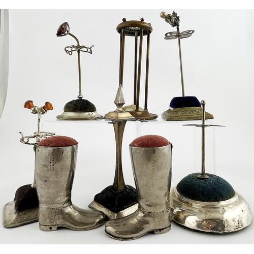 278 - HAT PIN GROUP. Tallest 6ins. Various shapes: Boots & different stands. Pewter? Boots are heavy. Dama... 