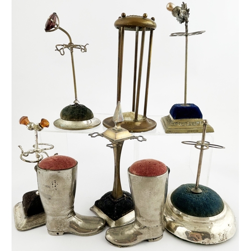 278 - HAT PIN GROUP. Tallest 6ins. Various shapes: Boots & different stands. Pewter? Boots are heavy. Dama... 