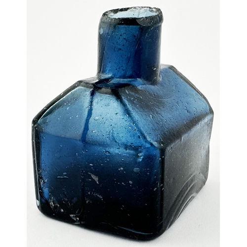 454 - UNEMBOSSED BLUE GLASS COTTAGE INK BOTTLE. 2.2ins tall. An extraordinary sheared lip, dark topaz glas... 