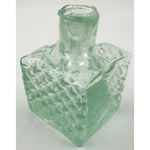 465 - VICTORIA CROSS MEDAL INK BOTTLE. (Inks book p102, D7.4). 2.5ins tall. Aqua glass, chunky cubic patte... 