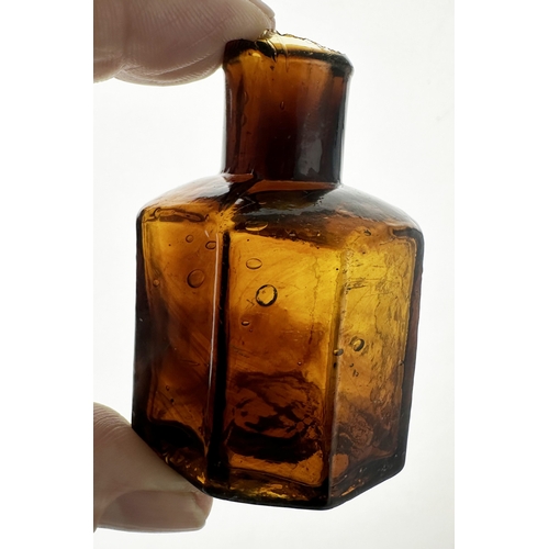 468 - AMBER OCTAGONAL INK BOTTLE WITH STRIATIONS. 2.25ins tall. An outstanding twist on a common octagonal... 