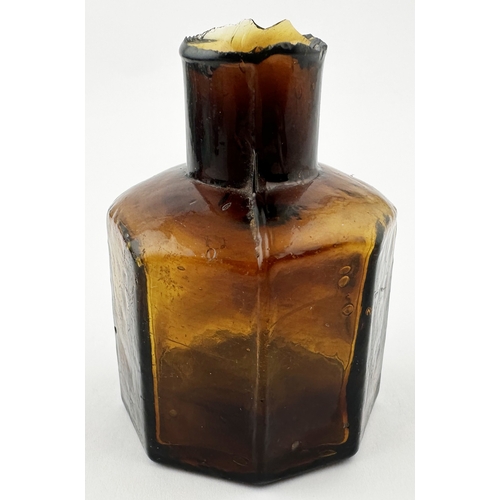 468 - AMBER OCTAGONAL INK BOTTLE WITH STRIATIONS. 2.25ins tall. An outstanding twist on a common octagonal... 