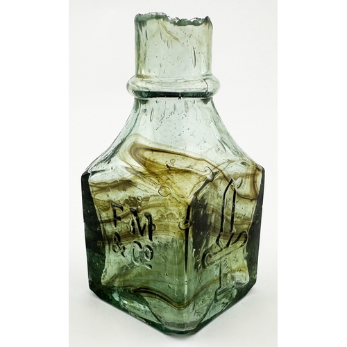 469 - F M & CO INK BOTTLE WITH BODY SWIRLS . (Inks book p131, 12.1). 2.6ins tall. Appealing sheared long l... 