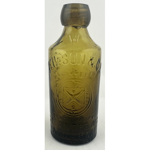 474 - WILSON & CO GLASS GINGER BEER BOTTLE. 7ins tall. Light amber glass, front & rear embossing WILSON & ... 