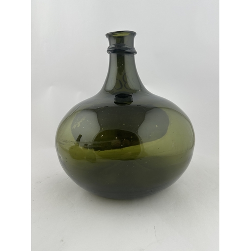 555 - PAINTED DUTCH WINDMILL SCENE BULBOUS BOLS BOTTLE. 10.3ins. Large bulbous bodied dark green bottle, t... 