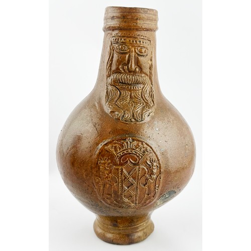 448 - BELLARMINE JUG. 9.25ins tall. A great looking wide mouthed Bellarmine, rear handle, flared foot. Mid... 