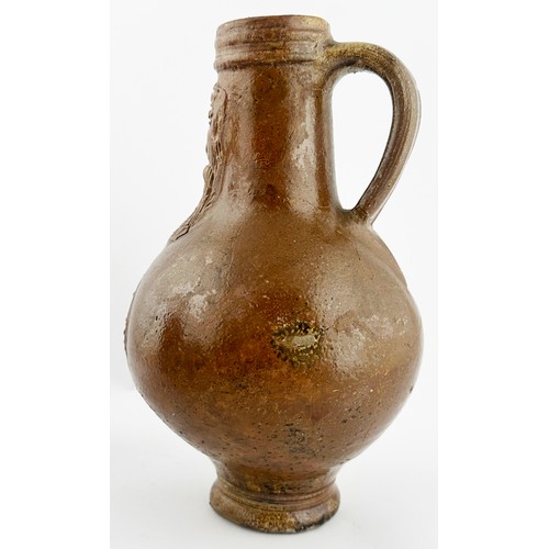 448 - BELLARMINE JUG. 9.25ins tall. A great looking wide mouthed Bellarmine, rear handle, flared foot. Mid... 