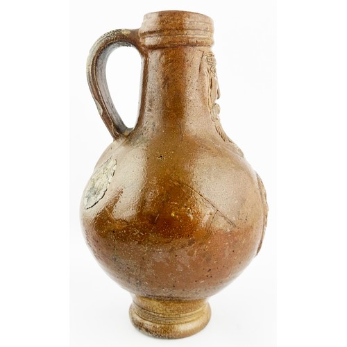 448 - BELLARMINE JUG. 9.25ins tall. A great looking wide mouthed Bellarmine, rear handle, flared foot. Mid... 