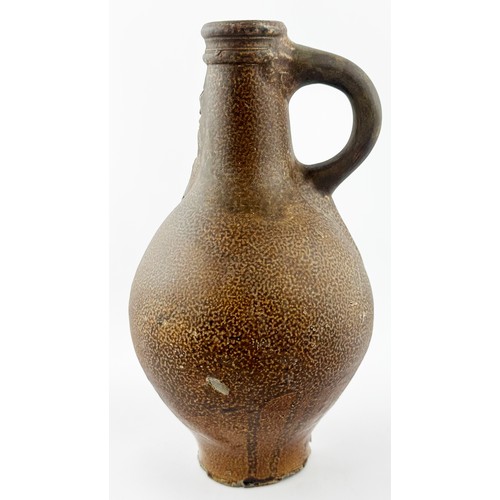 449 - BELLARMINE JUG. 8.75ins tall. Standard narrow bodied bellarmine in variating orange peel salt glaze.... 