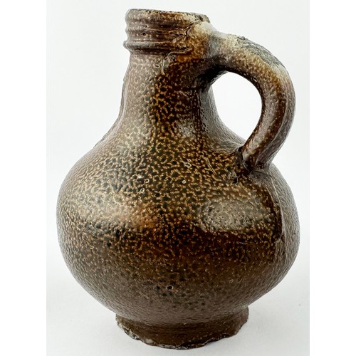 450 - BELLARMINE JUG. 5.25ins tall. A delightful, very rare, diminutive (small!) dark brown orange peel ef... 