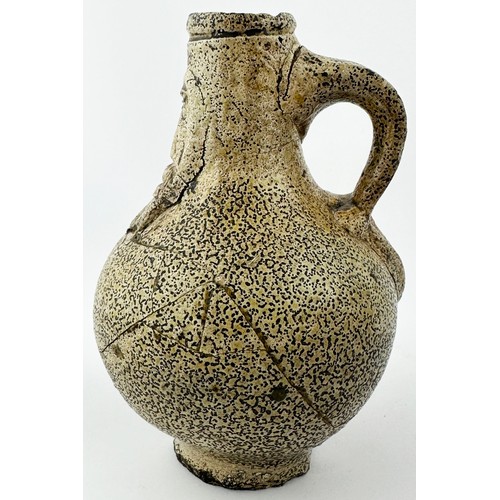 451 - BELLARMINE JUG. 5.75ins tall. An extraordinary small size jug in a pale cream, very thick looking, g... 