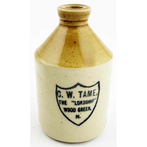 110 - HARINGEY WOOD GREEN MINIATURE FLAGON. 3.6ins tall, t.t. handled flagon, front transfer G W TAME/ THE... 