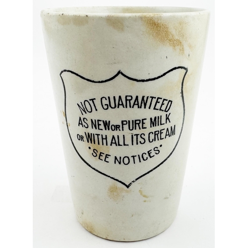 70 - AS NEW OR PURE MILK BEAKER. 4.1ins tall. White with simple black transfer, shield saying NOT GUARANT... 