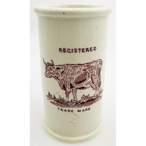 72 - TUCKERS CREAM POT. 4.6ins tall. Maroon transfer, 6 lines of writing to front, cow pict to back. DEVO... 
