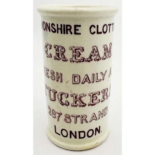 72 - TUCKERS CREAM POT. 4.6ins tall. Maroon transfer, 6 lines of writing to front, cow pict to back. DEVO... 